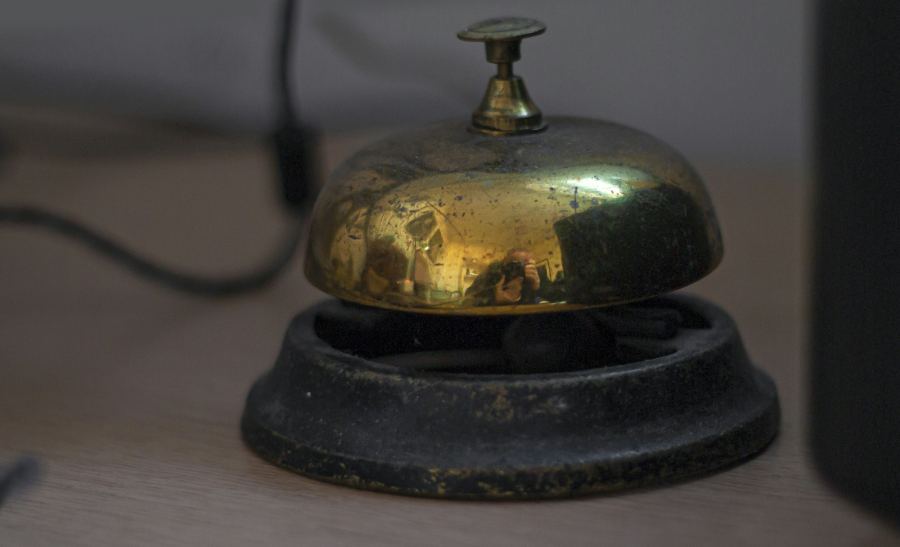 A service bell on a hotel front desk